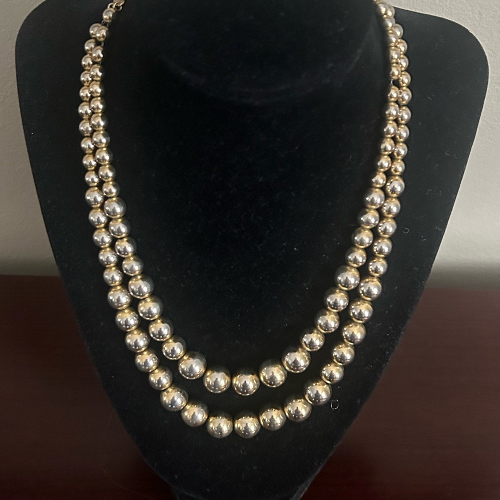 Vintage Hobe double strand gold metal beaded necklace. Signed.